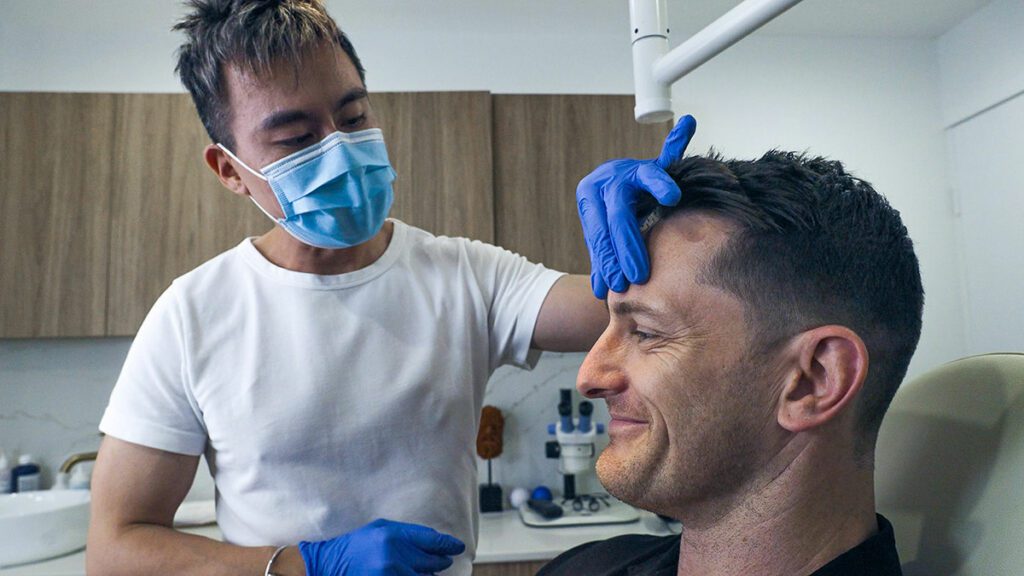Male Cosmetic Doctor in Brisbane doing Consultation with Male Patient for Facial | Eleventh Heaven™ Male Cosmetic Doctor in Brisbane doing Consultation with Male Patient for Facial