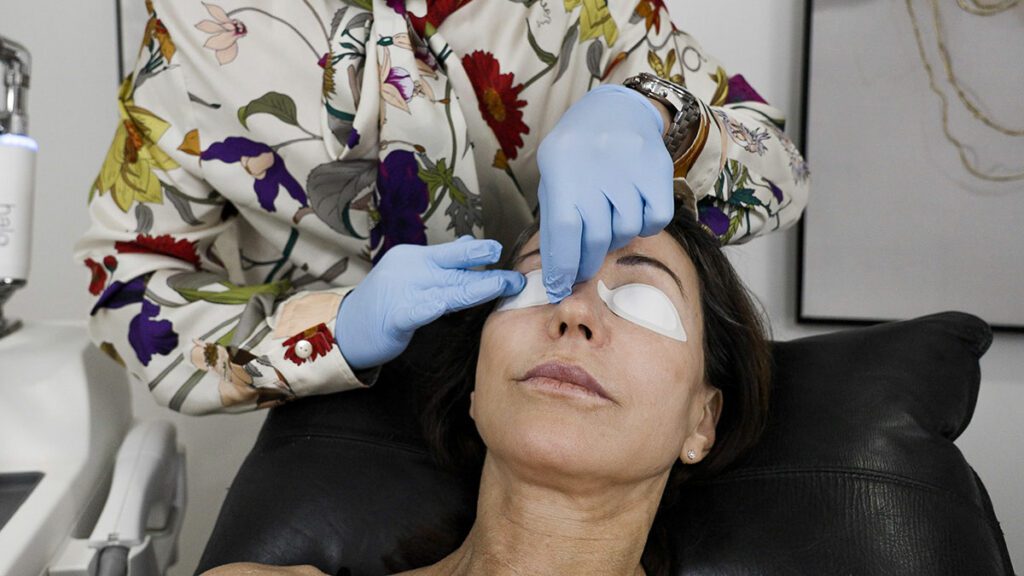 Women getting eye patch for Sciton Laser Cosmetic Treatment Facial in Brisbane Cosmetic Clinic | Eleventh Heaven™ Women getting eye patch for Sciton Laser Cosmetic Treatment Facial in Brisbane Cosmetic Clinic