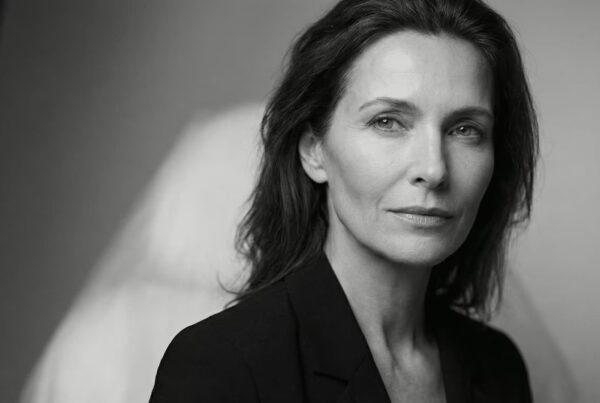 Forehead Contouring & Upper Face Architecture | Eleventh Heaven Grayscale editorial portrait of an elegant mature woman showing subtle forehead flattening and volume loss, representing the structural assessment for forehead contouring and brow support at Eleventh Heaven Brisbane.