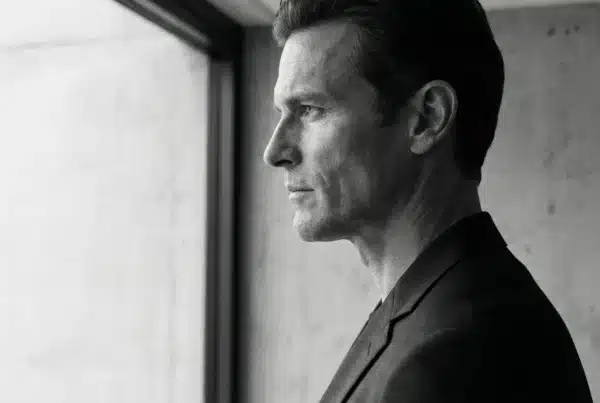 Masculine Jawline & Chin Structure | Eleventh Heaven Monochrome side profile portrait of a man with defined masculine jawline and chin structure, illustrating doctor-led profile balancing at Eleventh Heaven Brisbane.